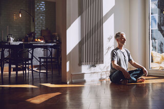 Zehnder_RAD_Charleston-HY_Yoga man meditates, old building flat, relaxed, charleston